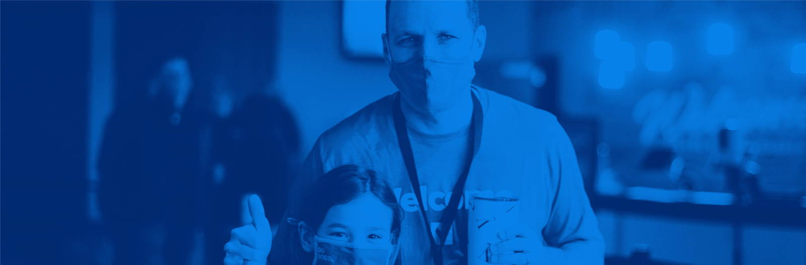 TVC Greeters giving thumbs up